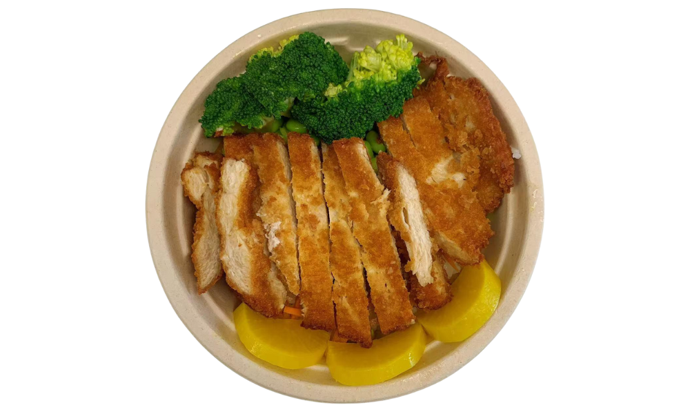 Bowl with crispy chicken katsu, broccoli, and veggies at Poke 46, a Japanese Restaurant in Pine Brook
