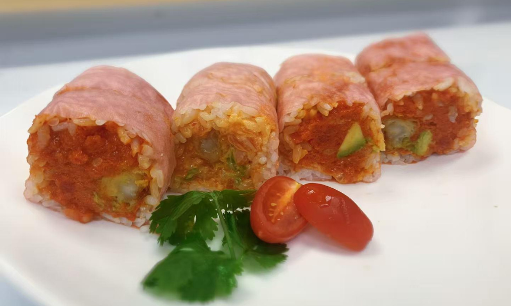Sushi roll with ham, spicy filling, and avocado at Poke 46, a Japanese Restaurant in Pine Brook