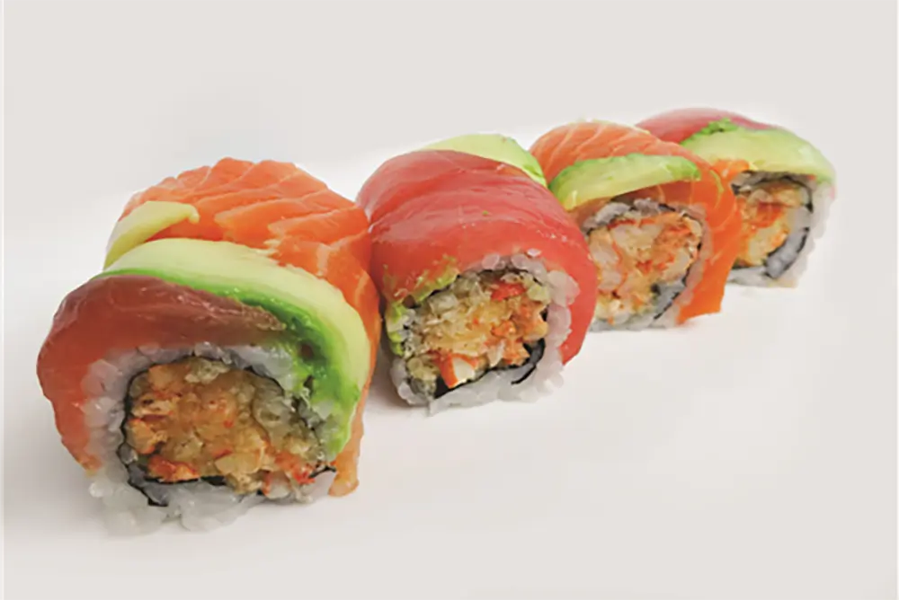 Rainbow spicy crab sushi roll with salmon tuna avocado at Poke Fresh, a Poke bar in Houston