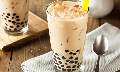 Classic iced boba milk tea with chewy tapioca pearls at Poke House Huntington, a Hawaiian restaurant in Huntington