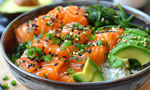 Fresh salmon poke bowl with avocado, seaweed, and green onions at Poke House Huntington, a Hawaiian restaurant in Huntington