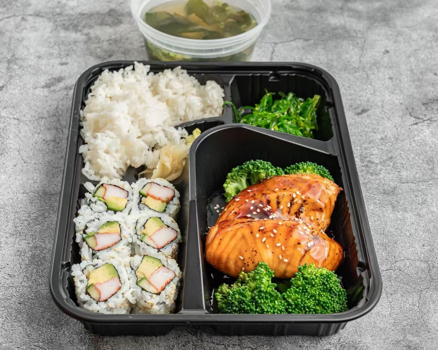 Grilled teriyaki salmon bento with sushi, rice, broccoli, and seaweed salad at Poke House Huntington, a Hawaiian restaurant in Huntington Grilled teriyaki salmon bento with sushi, rice, broccoli, and seaweed salad at Poke House Huntington, a Hawaiian restaurant in Huntington