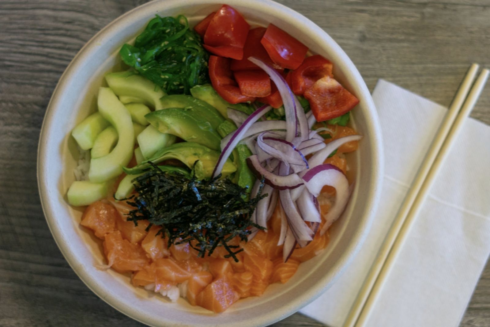 Salmon poke bowl with avocado, seaweed and veggies at Poke King, a Hawaiian Restaurant in Spokane