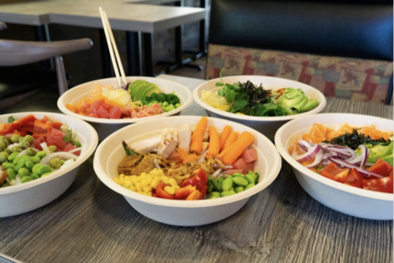 Platter of poke bowls with seafood, chicken and fresh produce at Poke King, a Hawaiian Restaurant in Spokane