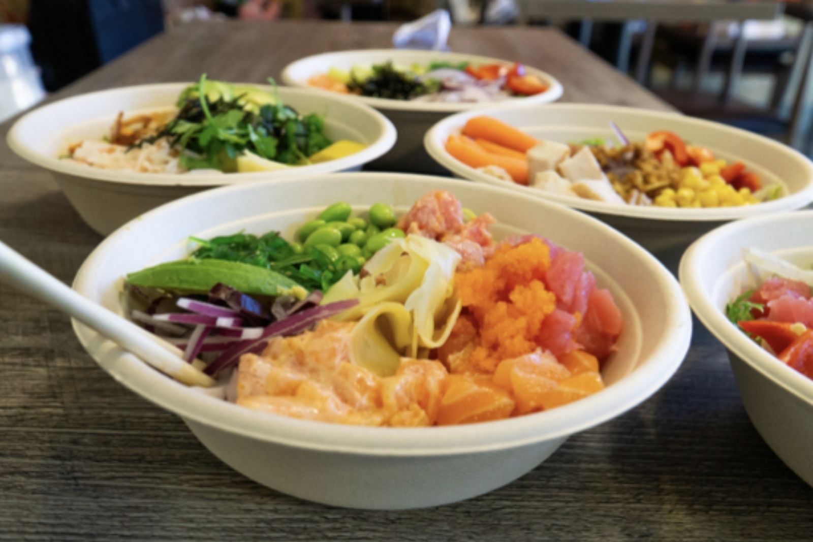 Assorted poke bowls with salmon, tuna and fresh veggies at Poke King, a Hawaiian Restaurant in Spokane