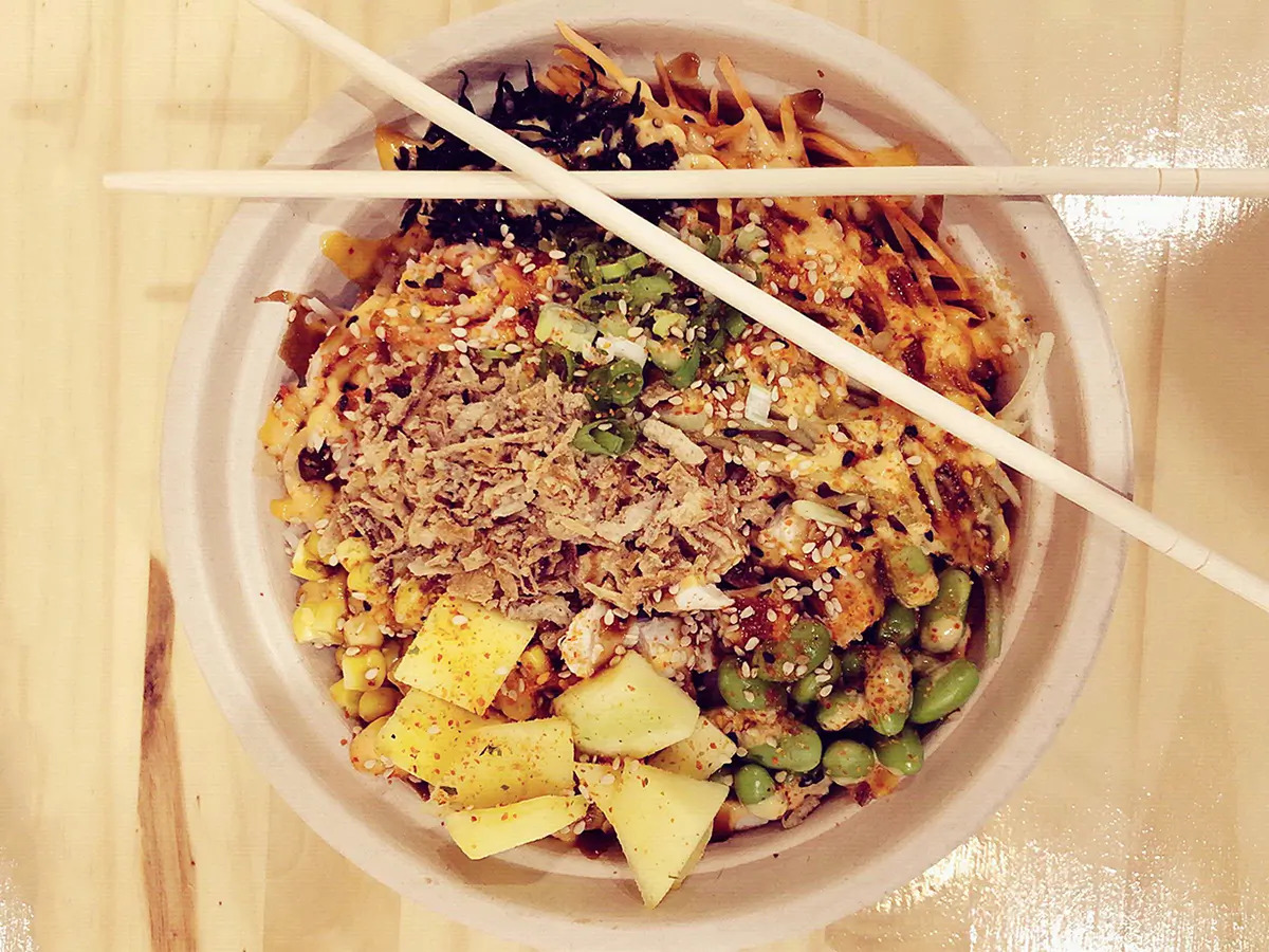 Pokéloha-Asian-Fusion-Restaurant-Spicy-Poke-Bowl-KS Spicy poke bowl with pineapple, edamame, and sesame seeds at Pokéloha, a Asian Fusion Restaurant in Woonsocket
