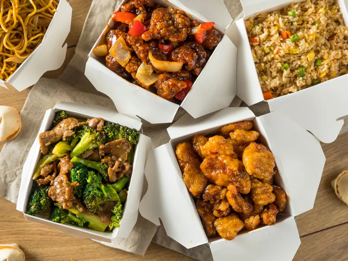 Pokéloha-Asian-Fusion-Restaurant-Chinese-Takeout-Combo-KS Assorted Chinese takeout dishes including fried noodles and orange chicken at Pokéloha, a Asian Fusion Restaurant in Woonsocket
