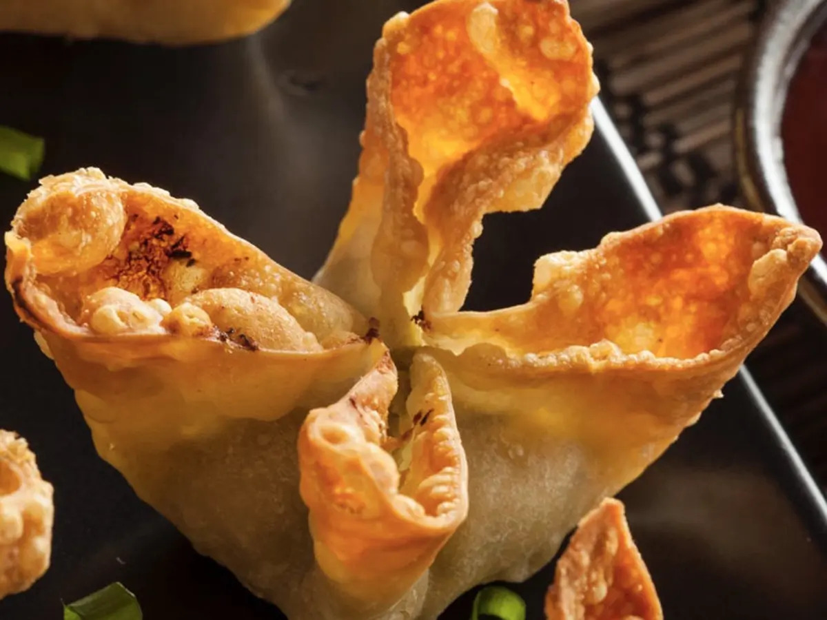 Pokéloha-Asian-Fusion-Restaurant-Fried-Dumplings-KS Crispy fried dumplings, golden - brown and ready for dipping at Pokéloha, a Asian Fusion Restaurant in Woonsocket