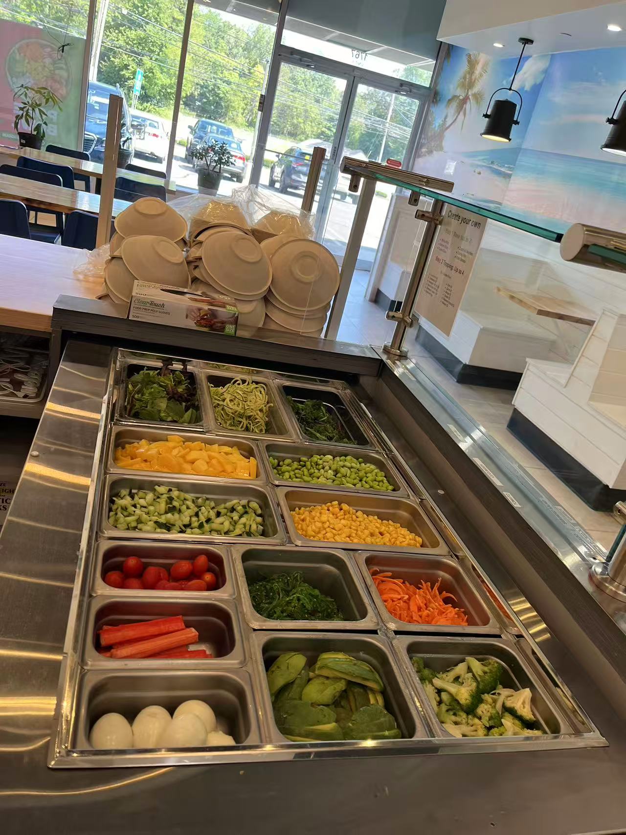 Poke-One-Poke-Bowl-Restaurant-Morris-Plains Vegetable and protein station with assorted chopped veggies and eggs for custom bowls.