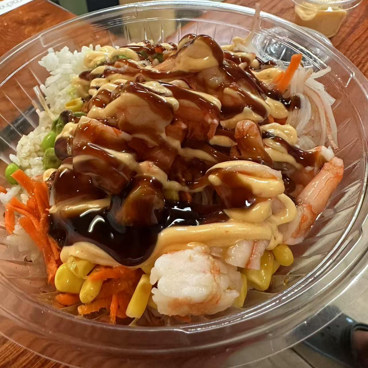 Poke-Star-Hawaiian-Poke-Bowl-Restaurant-Shrimp-Poke-Bowl-with-Sauces-Clemson Shrimp Poke Bowl with Sauces - Shrimp, rice, and vegetables drizzled with multiple sauces at Poke Star, a Hawaiian Poke Bowl Restaurant in Clemson