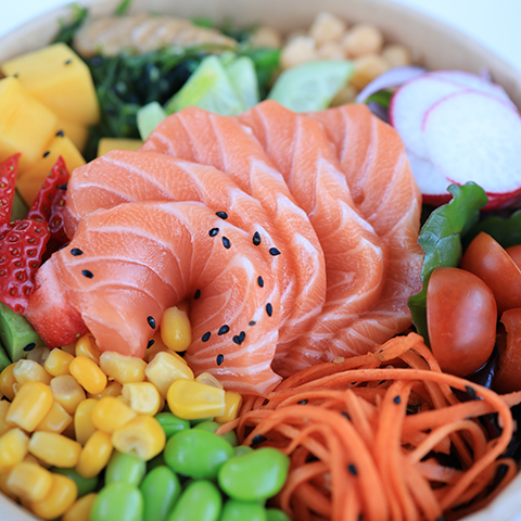 Salmon Vegetable Poke Bowl - Fresh salmon slices served with an assortment of vegetables like cucumber, corn, and edamame at Poke Star, a Hawaiian Poke Bowl Restaurant in Clemson