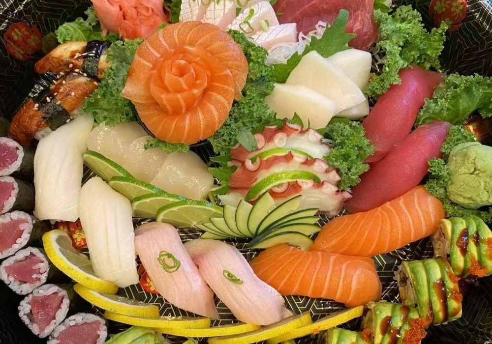 Artfully arranged sushi and sashimi platter with salmon rose at Poke Zone, a Japanese Restaurant in Edgewater