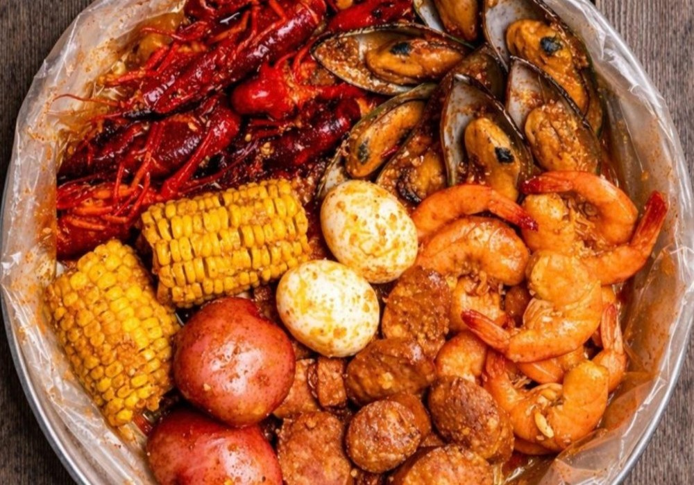 Spicy seafood boil with crawfish, mussels, shrimp, and corn at Poke Zone, a Japanese Restaurant in Edgewater