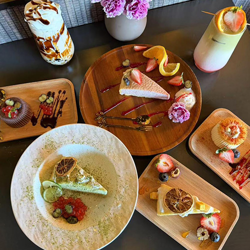 Assorted Desserts A variety of desserts including cake slices and fruit tarts at Pop Ice Cream, a Dessert Shop restaurant in Bonita Springs