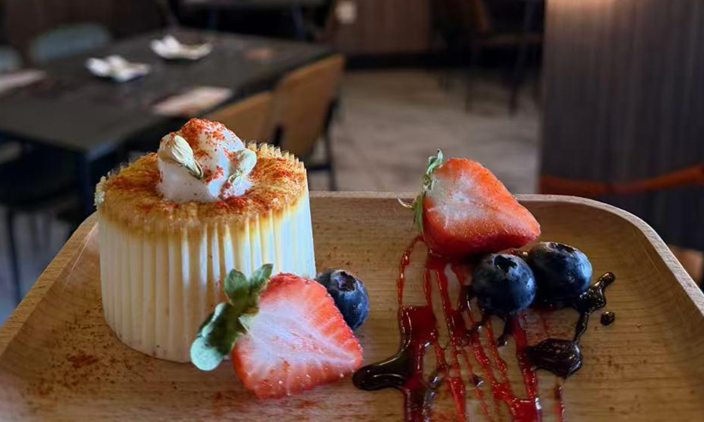 Caramelized crème brûlée with whipped cream, fresh strawberries and blueberries at Pop Ice Cream, a Dessert Shop restaurant in Bonita Springs