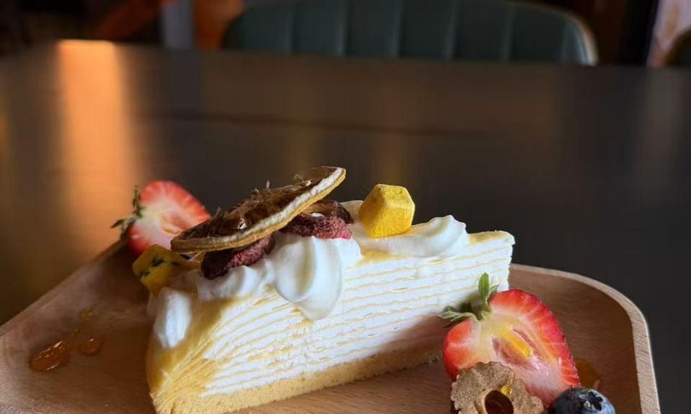 Layer Cake A layered cake with cream and fruit toppings at Pop Ice Cream, a Dessert Shop restaurant in Bonita Springs
