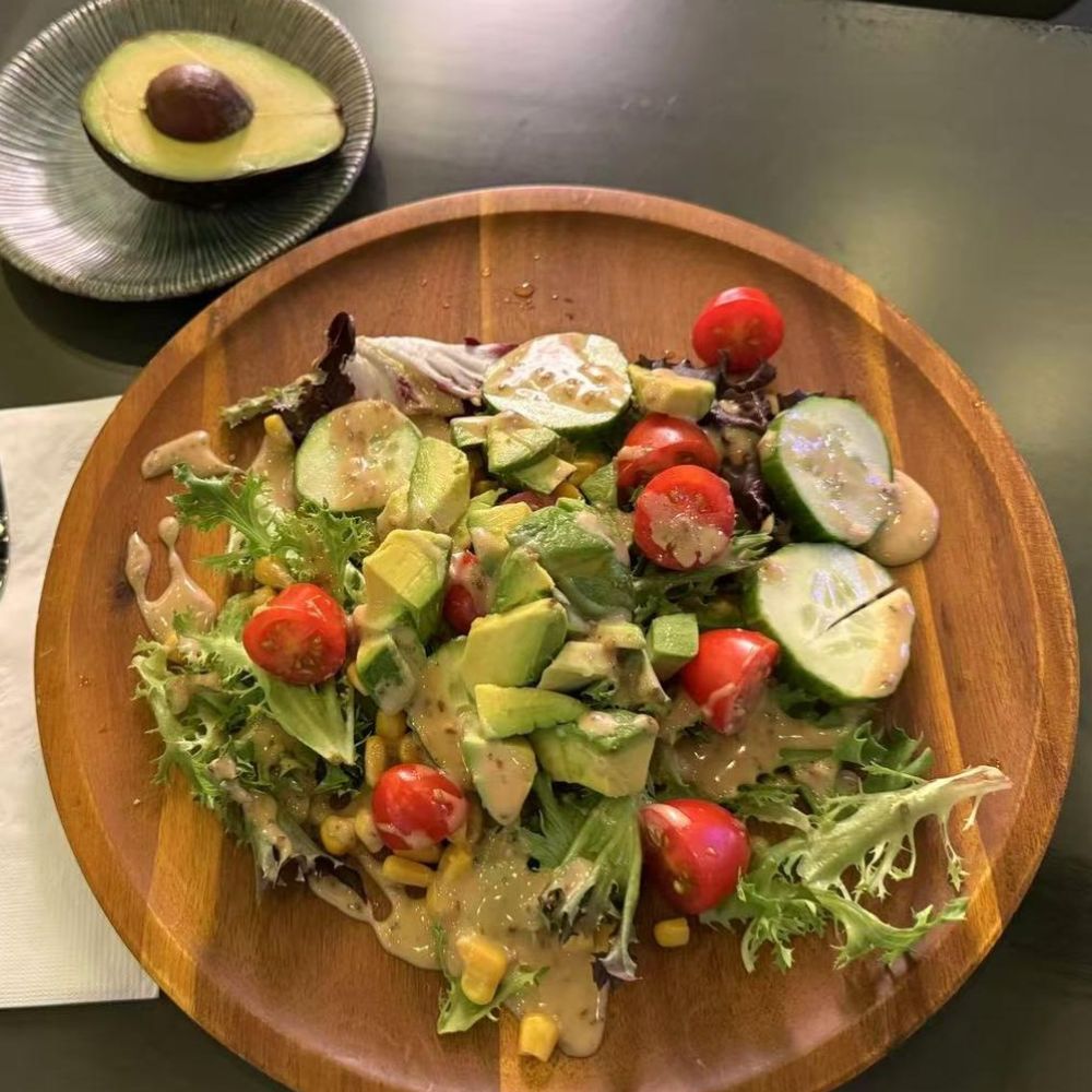 Avocado salad with veggies and dressing at Pop Onigiri, a Japanese Restaurant in Bonita Springs