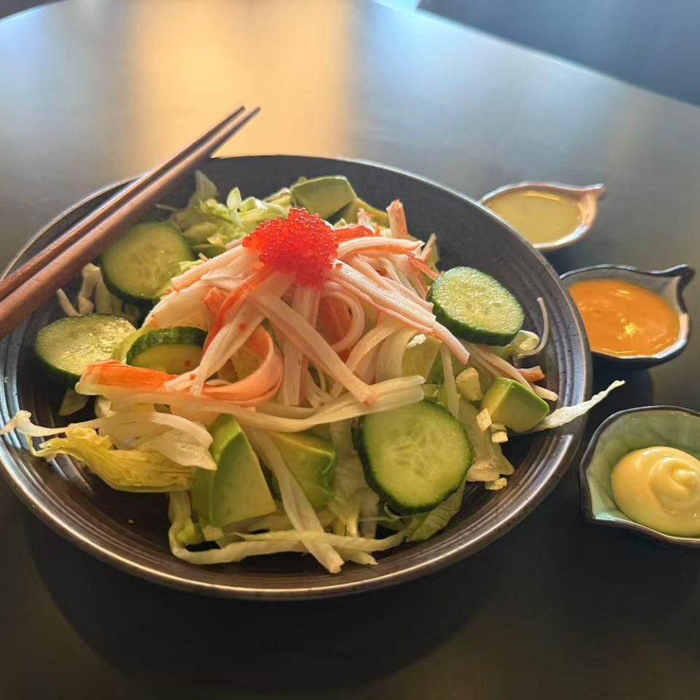 Crab and avocado salad with sauces at Pop Onigiri, a Japanese Restaurant in Bonita Springs
