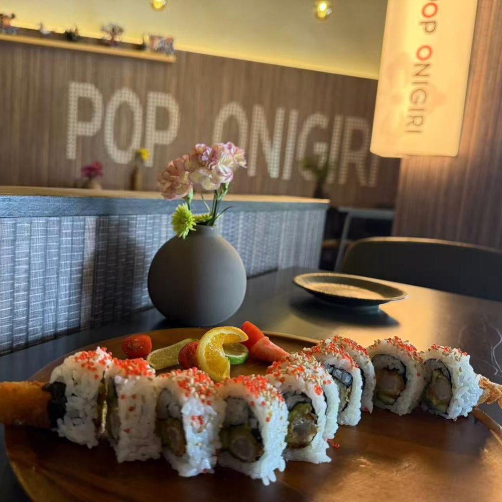 Decorated sushi rolls with fruit slices at Pop Onigiri, a Japanese Restaurant in Bonita Springs