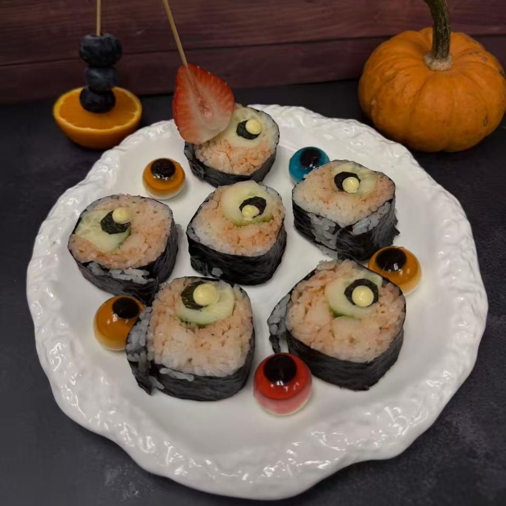 Halloween-themed sushi rolls with decorative elements at Pop Onigiri, a Japanese Restaurant in Bonita Springs