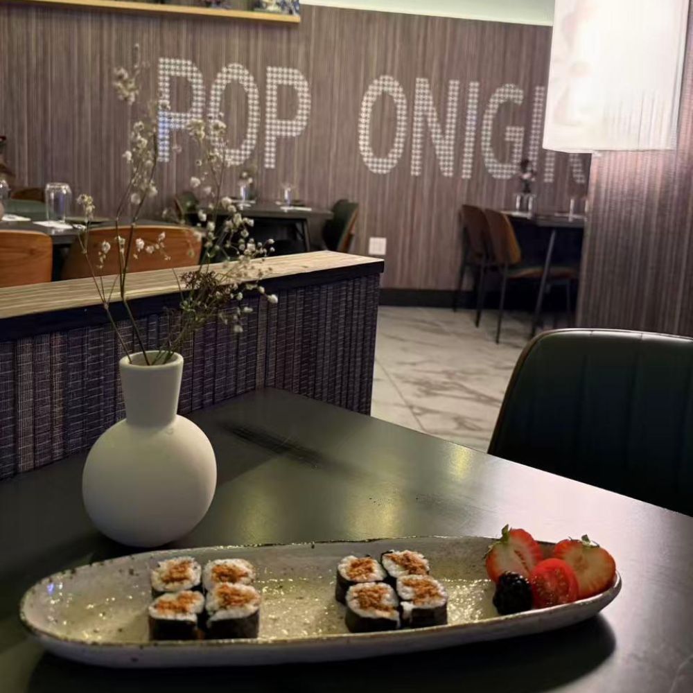 Mini sushi set with fruit slices at Pop Onigiri, a Japanese Restaurant in Bonita Springs