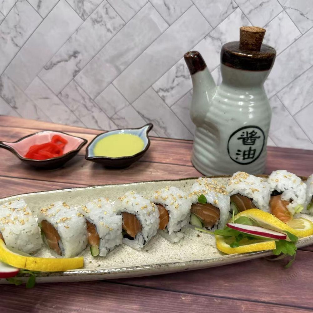 Salmon sushi rolls with sesame seeds at Pop Onigiri, a Japanese Restaurant in Bonita Springs