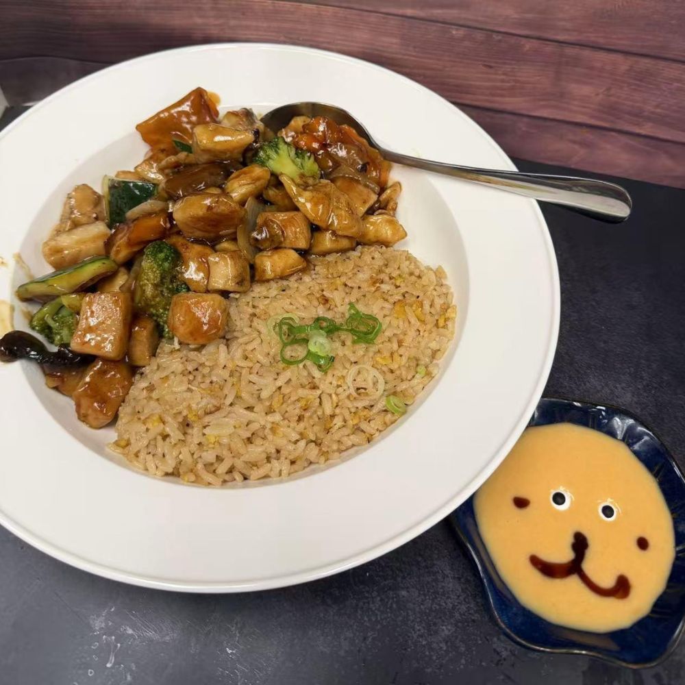 Green tea mille crepe cake with lime and red currant garnish at Pop Onigiri, a Japanese Restaurant in Bonita Springs