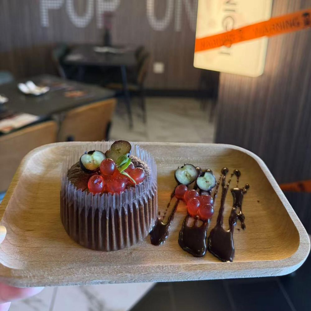 Rich chocolate cup cake with red currant and grape topping at Pop Onigiri, a Japanese Restaurant in Bonita Springs
