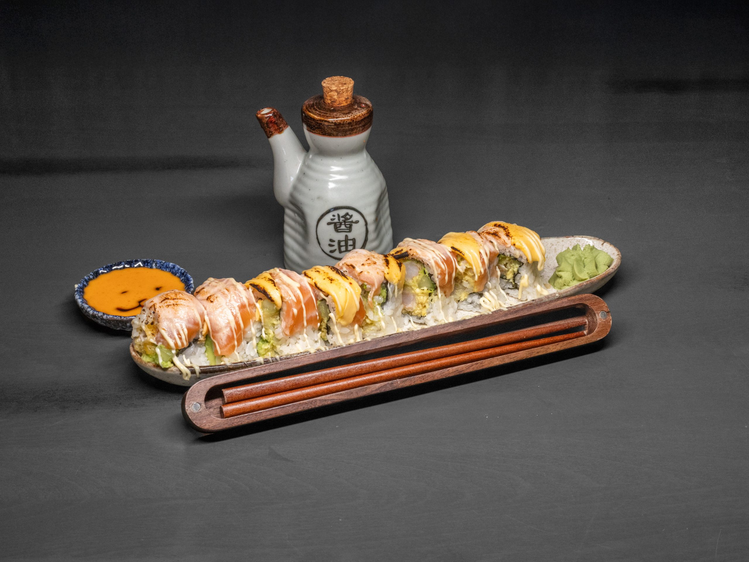 Cooked salmon cheese roll with melted cheese at Pop Onigiri, a Japanese Restaurant in Bonita Springs