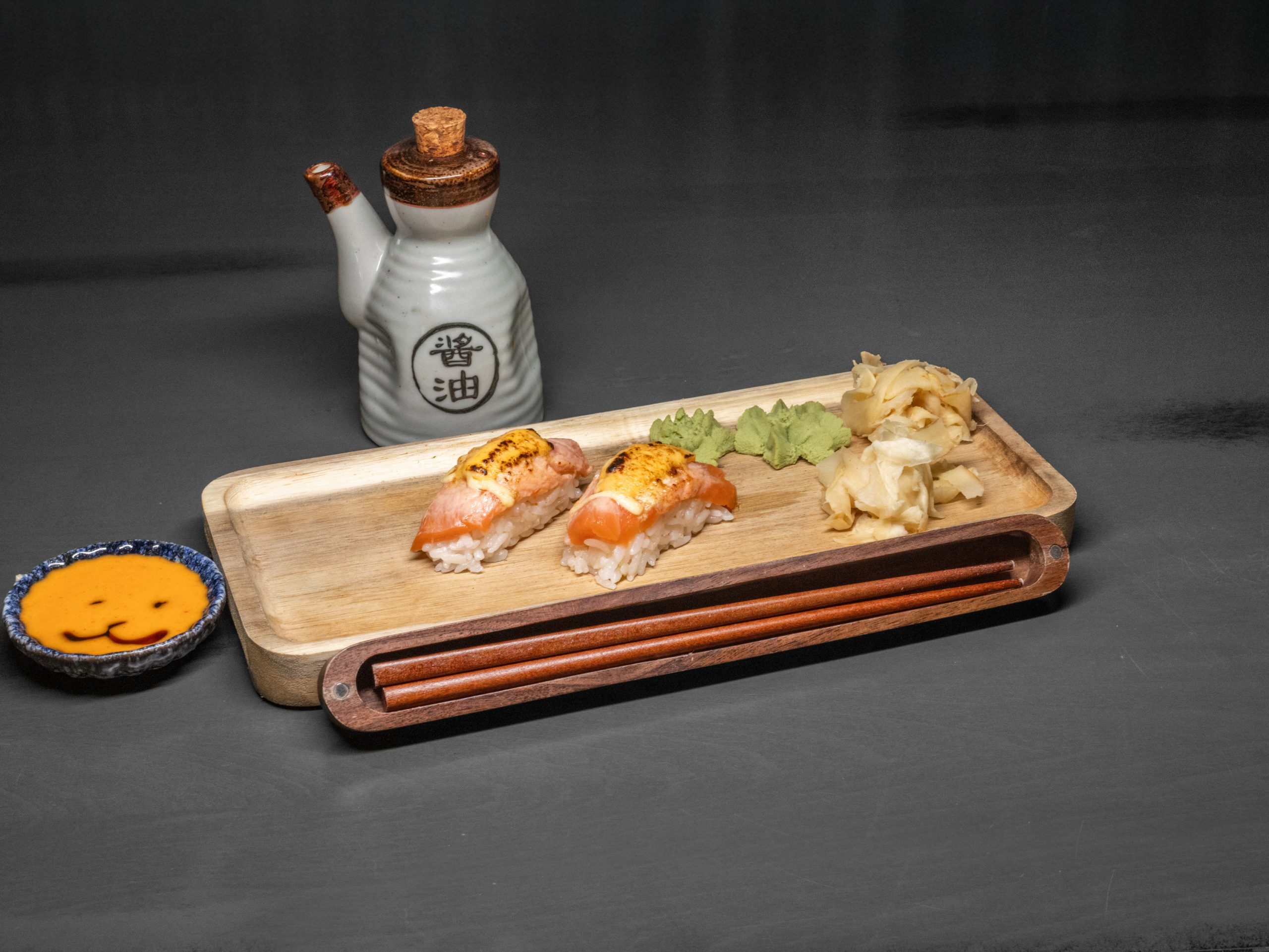 2pcs tender cooked salmon sushi at Pop Onigiri, a Japanese Restaurant in Bonita Springs