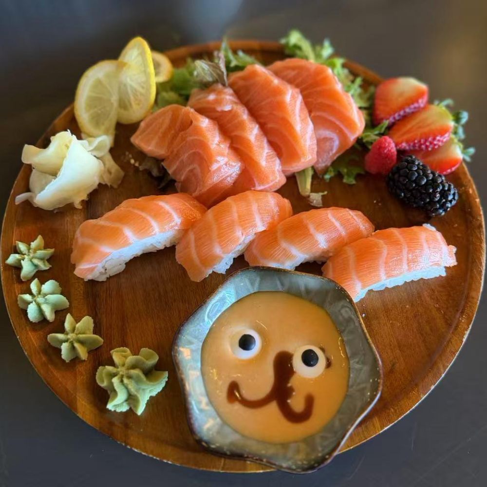 Fresh salmon sushi and sashimi with cute dipping sauce at Pop Onigiri, a Japanese Restaurant in Bonita Springs