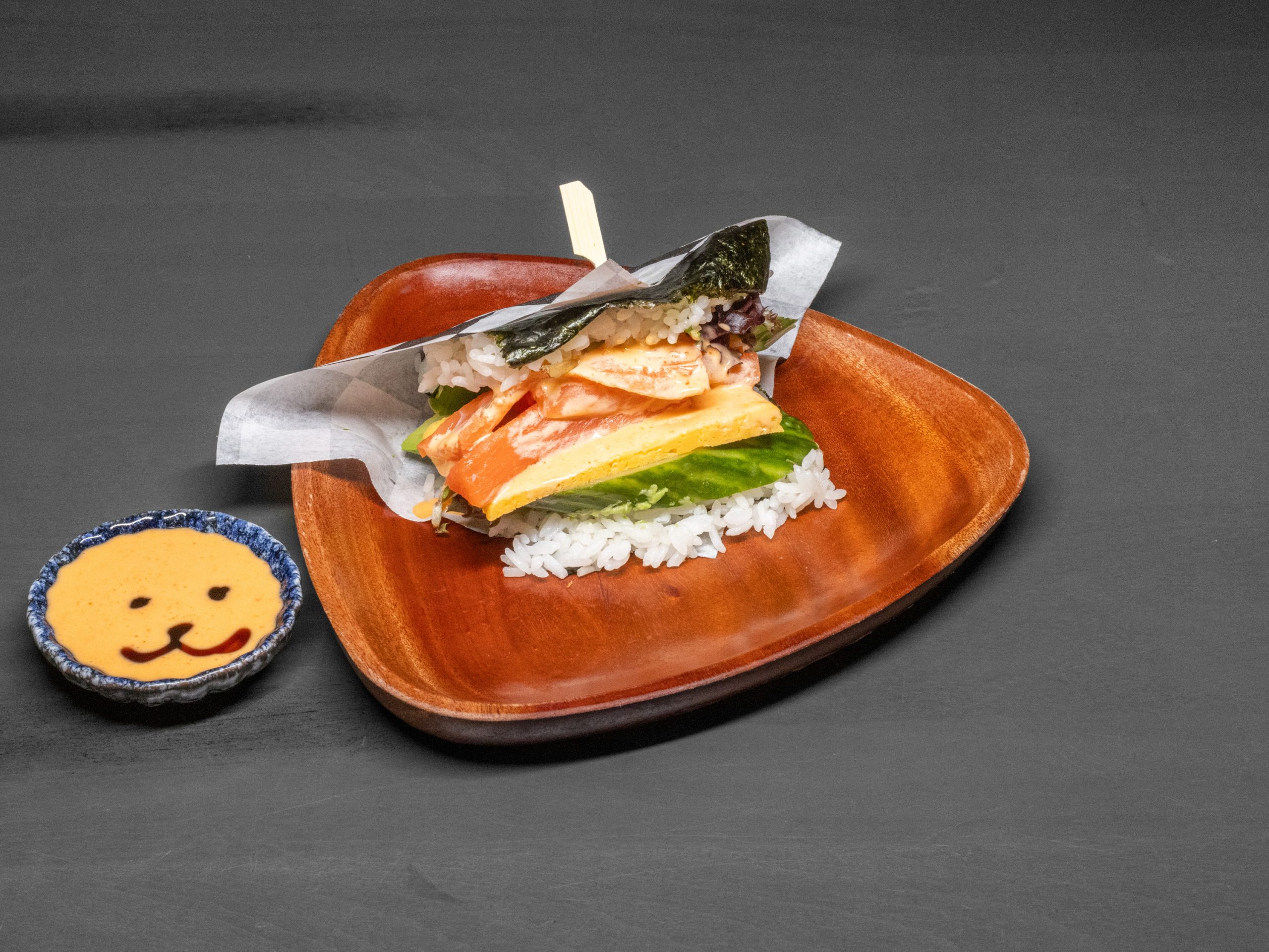 Spicy salmon onigiri with toppings at Pop Onigiri, a Japanese Restaurant in Bonita Springs