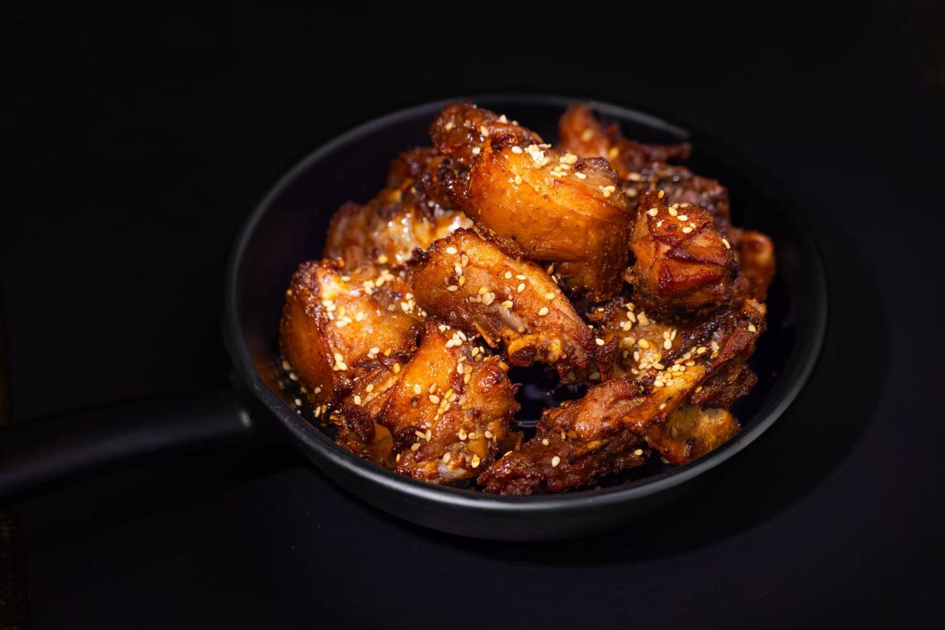 Sesame Chicken Bites - Crispy chicken pieces with sesame seeds at Potato Powder Love Noodle, a Chinese Restaurant in San Diego