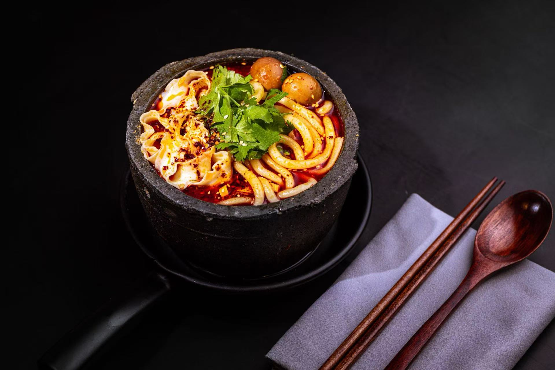 Spicy Wonton Potato Noodle Soup - Udon noodles with spicy wontons & quail eggs at Potato Powder Love Noodle, a Chinese Restaurant in San Diego