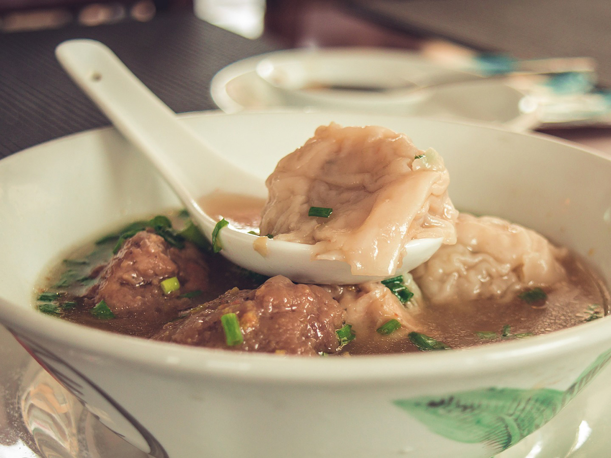 Soup dumplings and meatballs in savory broth at Precious, a Chinese Restaurant in Austin