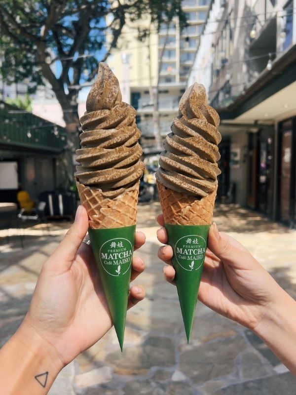 Two soft serves (hojicha, black sesame) in cones at Premium Matcha Cafe Maiko, a Cafe in Portland