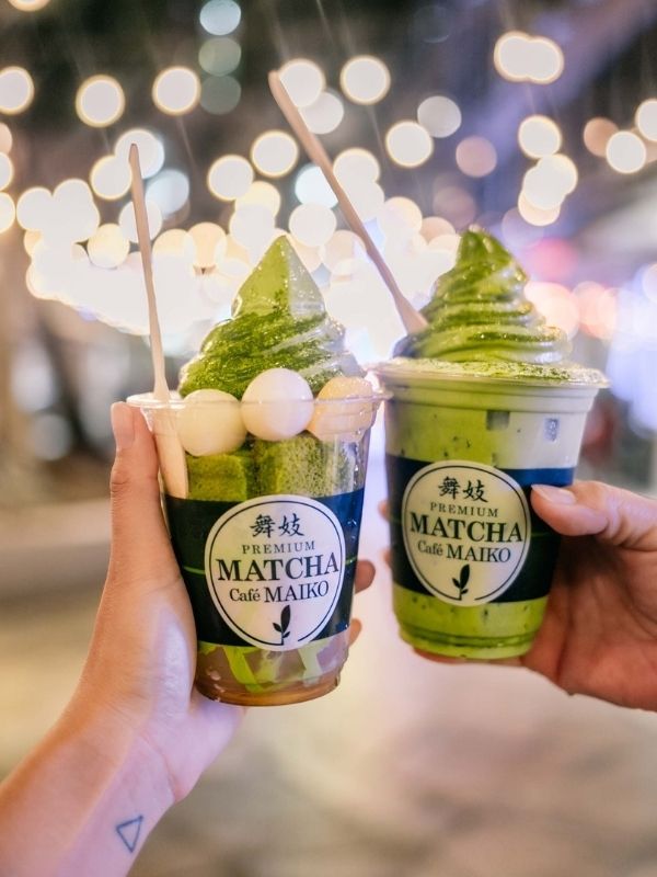 Two matcha soft serves in cups at Premium Matcha Cafe Maiko, a Cafe in Portland