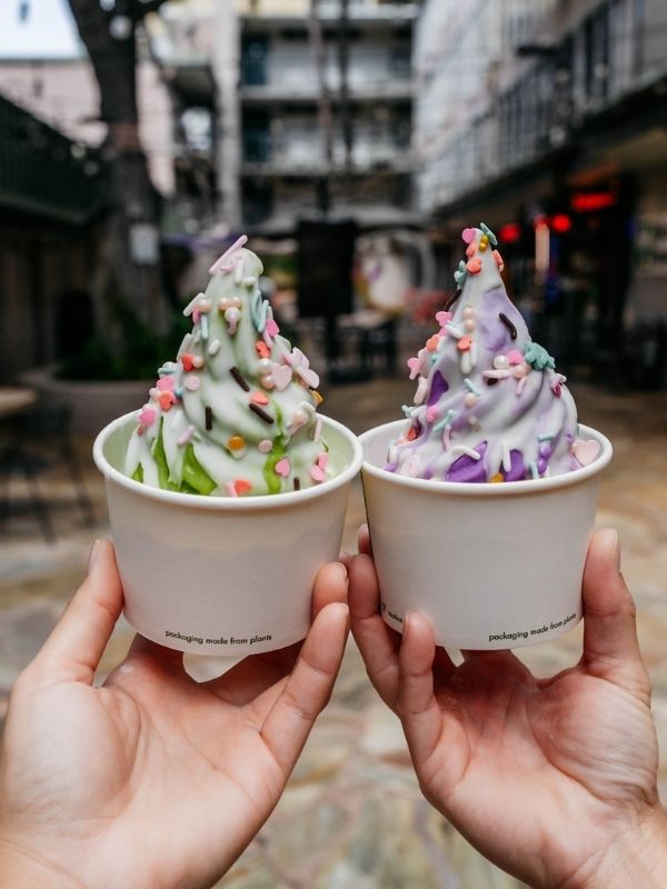 Two soft serves (green, purple) with sprinkles at Premium Matcha Cafe Maiko, a Cafe in Portland
