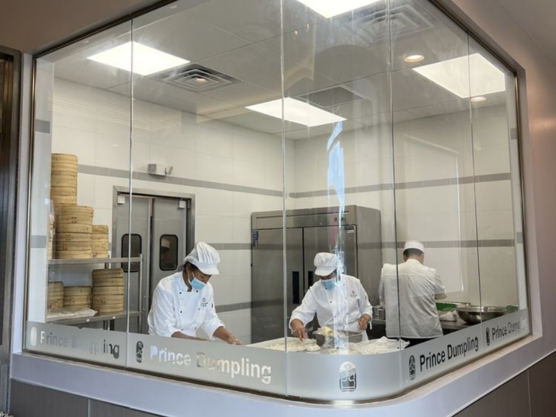 Open kitchen with chefs making food at Prince Dumpling, a Chinese Restaurant in Rosemead