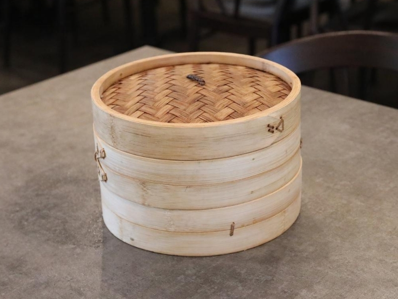 Stacked bamboo food steamers on table at Prince Dumpling, a Chinese Restaurant in Rosemead