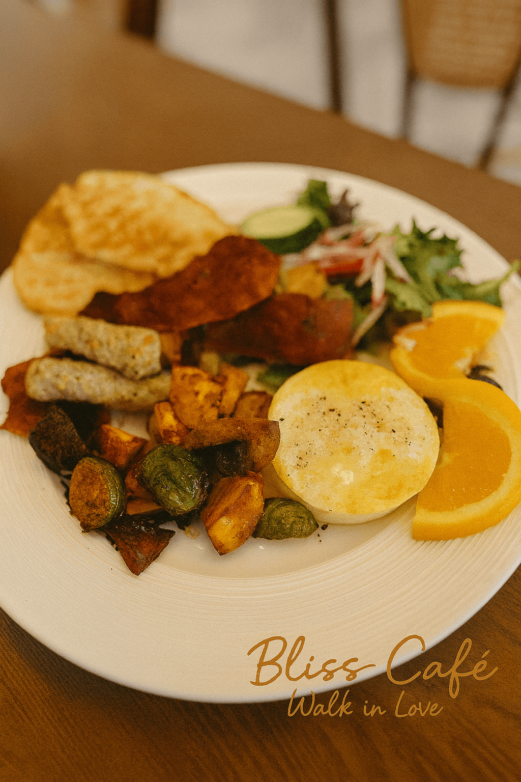 Brunch platter with eggs, sausages, veggies and fruits at Bliss Café, a Coffee Shop in Oviedo