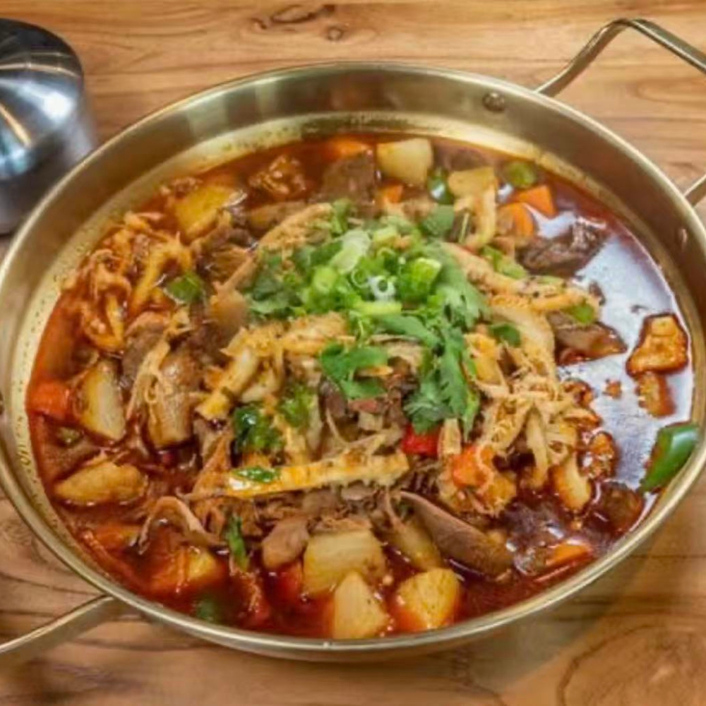 Qilu-Beef-Soup-Chinese-Restaurant-Mixed-Offal-Hot-Pot-Houston Assorted offal and veggies in spicy hot pot broth at Qilu Beef Soup, a Chinese Restaurant in Houston.