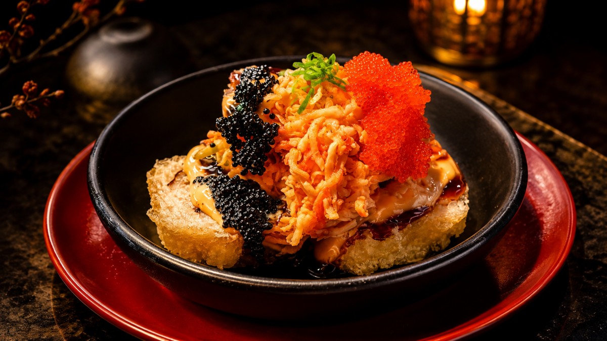 Crispy rice topped spicy crab salad dual caviar green onion black bowl set at Q Korean BBQ & Revolving Sushi Restaurant in Huntsville
