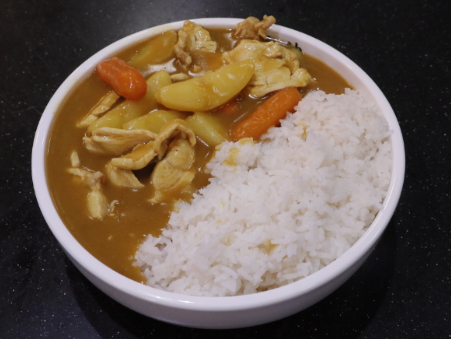 Curry rice with veggies and chicken. a Ramen Restaurant in Lincoln.