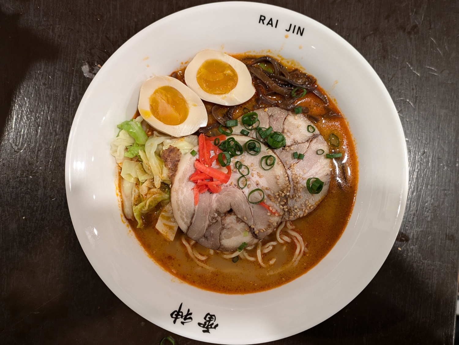 Rich ramen with eggs, veggies, broth. a Ramen Restaurant in Lincoln.