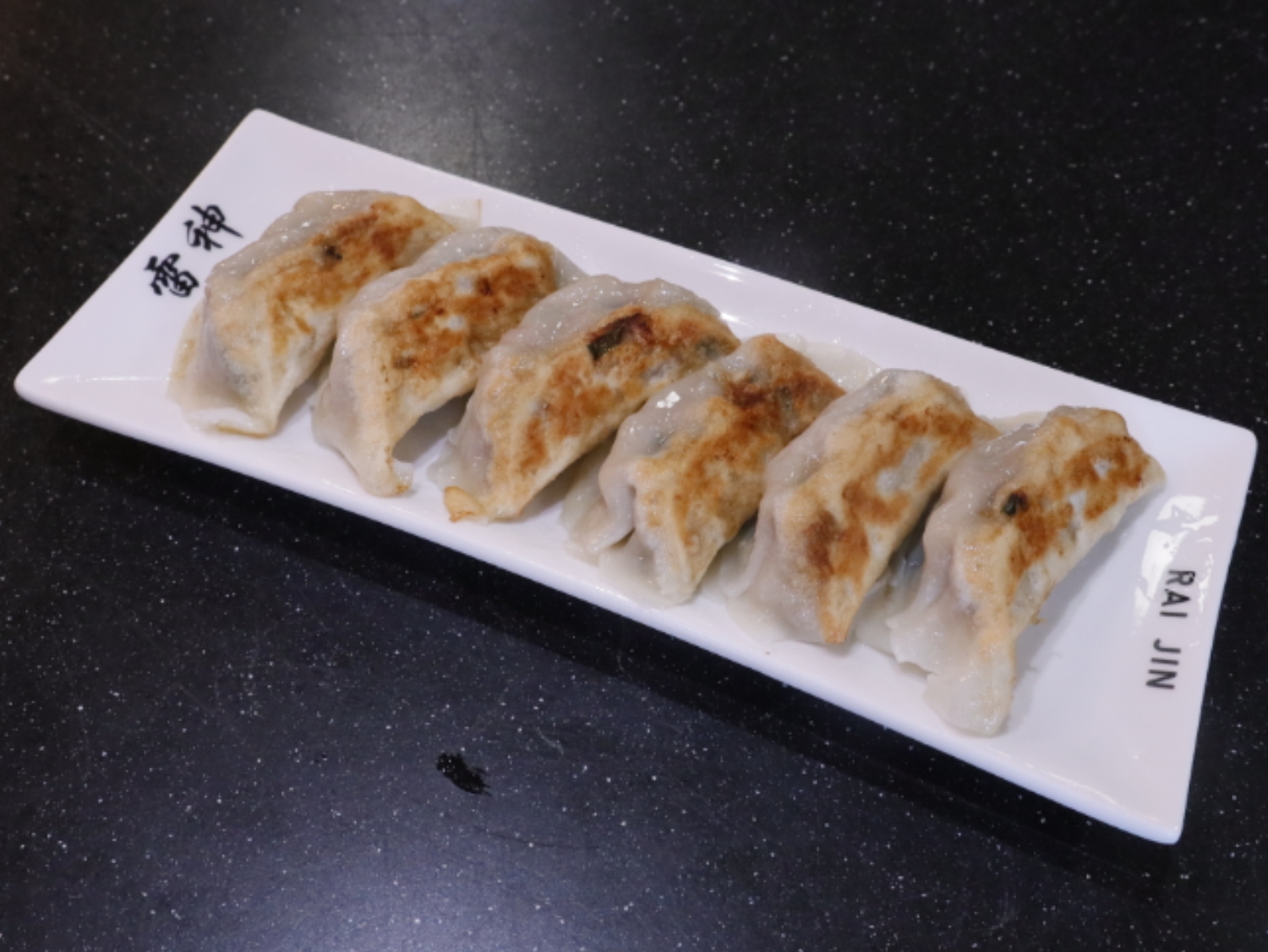 Crispy pan - fried dumplings. a Ramen Restaurant in Lincoln.