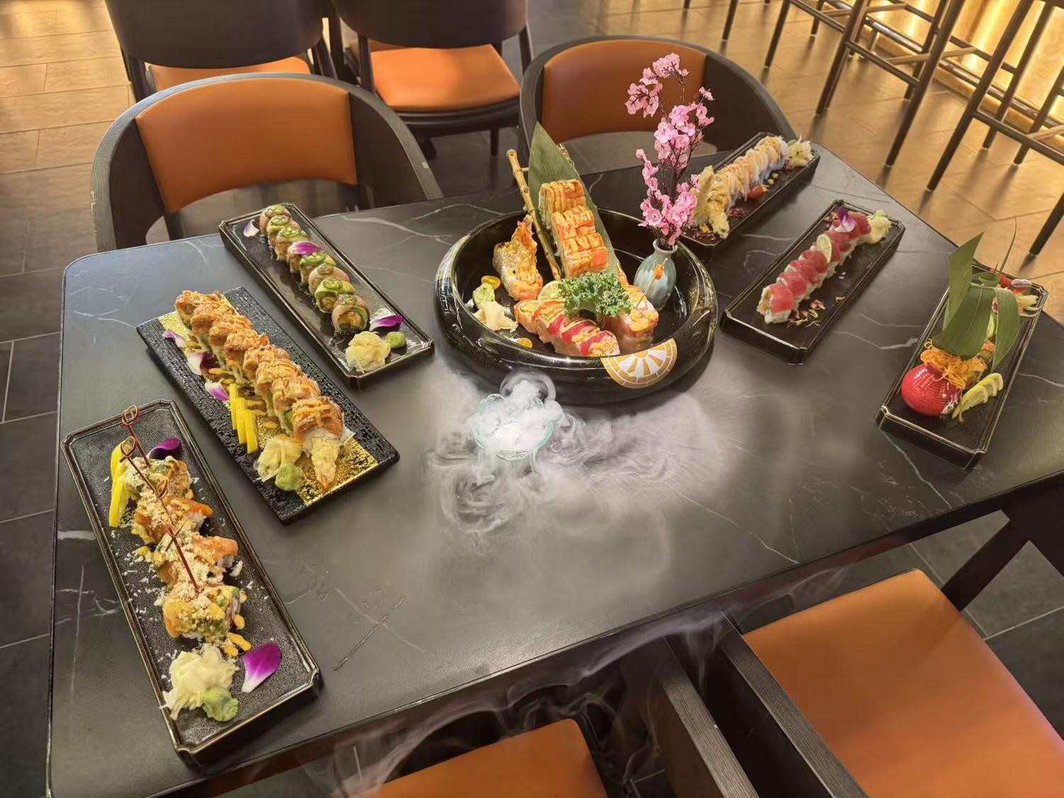 Artfully arranged sushi rolls platter with dry ice effect at Rakisuta Modern Sushi, Japanese Restaurant in Rockledge