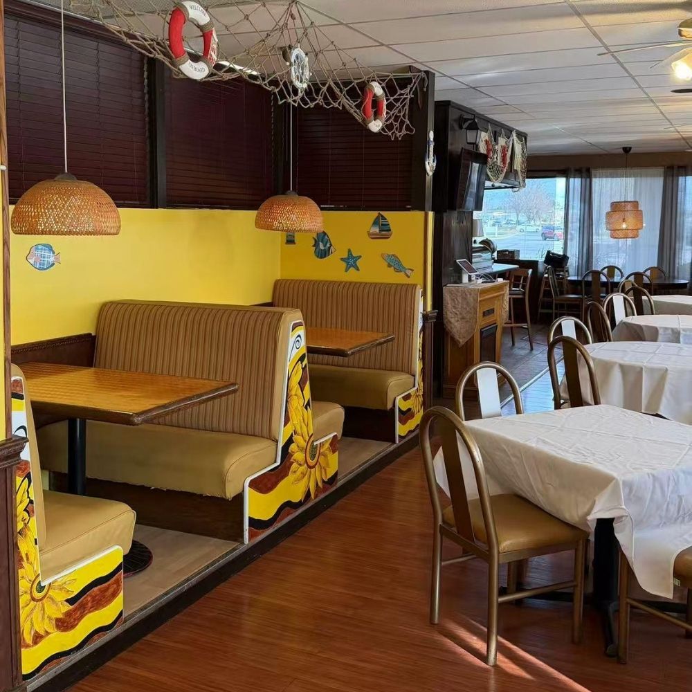 Cozy booths with sunflower decor and nautical accents at Raku Sushi, a Japanese Restaurant in Easton