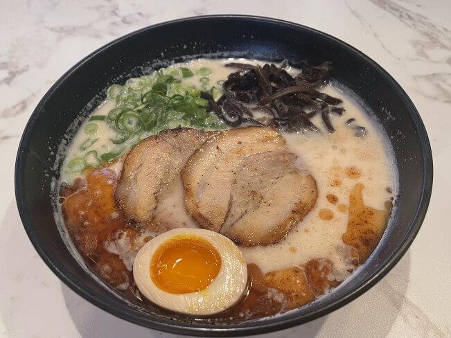 Pork Bone Ramen - Creamy pork bone broth ramen with slices of roasted pork, egg, and seaweed at Ramen Jin, a Ramen restaurant in Houston
