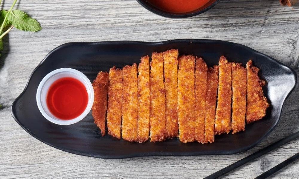 Crispy chicken katsu with red dipping sauce at RAMEN OSAKA, a Ramen Restaurant in San Jose